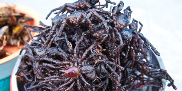 Deep fried Tarantula spiders, sold at hawker food stalls on Phnom Penh street. During the starvation years of Khmer Rouge rule people became adjusted to eating anything to survive. obviously tarantulas can be a tasty snack.