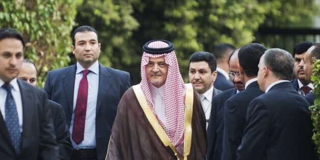 Saudi Foreign Minister Saud al-Faisal (C) arrives to attend an Arab League meeting on Syria on September 1, 2013 in Cairo, Egypt. 'Opposition to international action only encourages the regime to pursue its crimes,' the Saudi foreign minister told the Arab League meeting on the Syria crisis. AFP PHOTO/GIANLUIGI GUERCIA (Photo credit should read GIANLUIGI GUERCIA/AFP/Getty Images)