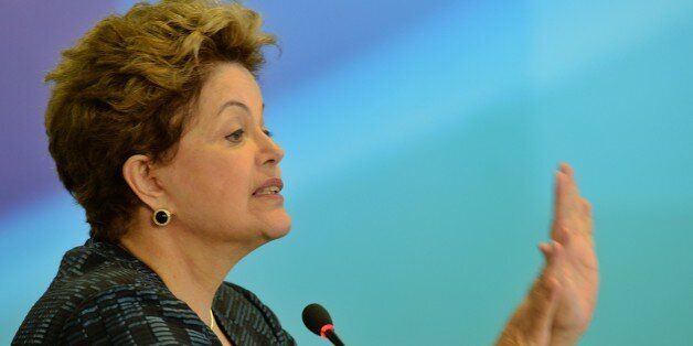 Brazilian President Dilma Rousseff delivers a speech during the announcement of the authorization to build private ports, at Planalto Palace in Brasilia, on July 3, 2013. AFP PHOTO/Evaristo SA (Photo credit should read EVARISTO SA/AFP/Getty Images)
