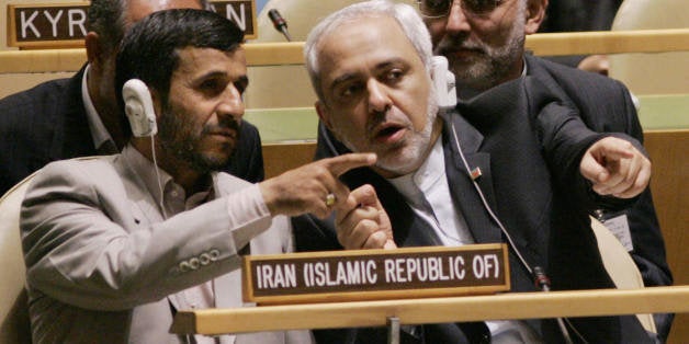 UNITED NATIONS, UNITED NATIONS: Iranian President Mahmoud Ahmadinejad (L) confers with Javad Zarif (R), Iran's United Nation