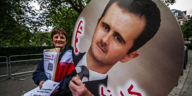 [UNVERIFIED CONTENT] Protesters gather outside the U.S. Embassy in London to demonstrate against United States intervention in the current Syrian uprising against the regime of President Bashar al-Assad.