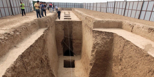 This picture taken on September 11, 2013 shows the tomb of Shangguan Wan'er -- a 7th-century female politician who was one of the most powerful women in ancient Chinese history -- being unearthed near an airport in Xianyang, northwest China's Shaanxi province, by Chinese archaeologists. Shangguan Wan'er, who lived from 664 to 710 in the Tang dynasty, was a trusted aide to China's first empress Wu Zetian, and married Wu's son, while having relationships with both the ruler's lover and her nephew. CHINA OUT AFP PHOTO (Photo credit should read STR/AFP/Getty Images)