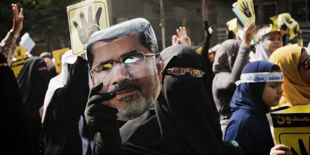 Members of the Muslim Brotherhood and suporters of ousted President Mohamed Morsi march through Cairo's Maadi Neighborhood on September 6, 2013. Thousands of supporters of ousted Egyptian president Mohamed Morsi turned out for protests in Cairo after Friday prayers, despite a sustained crackdown on Islamists by the country's new authorities. AFP PHOTO/GIANLUIGI GUERCIA (Photo credit should read GIANLUIGI GUERCIA/AFP/Getty Images)