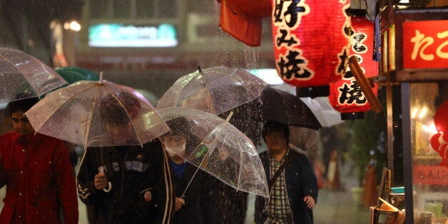 People walk through Namba area in a rainy day.