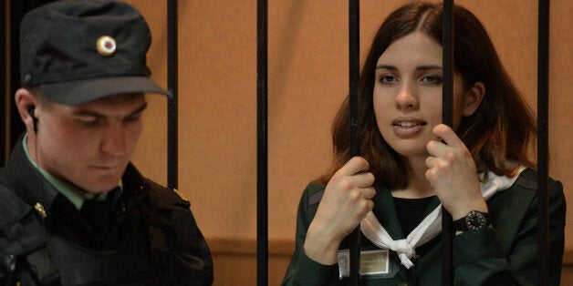 One of the jailed members of the all-girl punk band 'Pussy Riot,' Nadezhda Tolokonnikova, looks on while standing in the defe