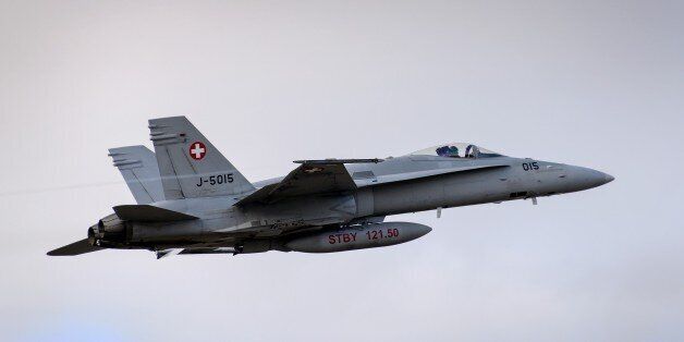 A F/A-18 Hornet fighter aircraft of the Swiss Air Force takes off on February 20, 2013 at Payerne airport. AFP PHOTO / FABRICE COFFRINI (Photo credit should read FABRICE COFFRINI/AFP/Getty Images)