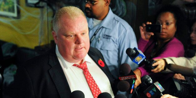 TORONTO, ON - OCTOBER 31: Toronto Mayor Rob Ford speaks to the media at his office door on the afternoon that documents of the arrest of his former driver and campaign worker Alessandro Lisi were to be released.October 31, 2013. (Richard Lautens/Toronto Star via Getty Images)