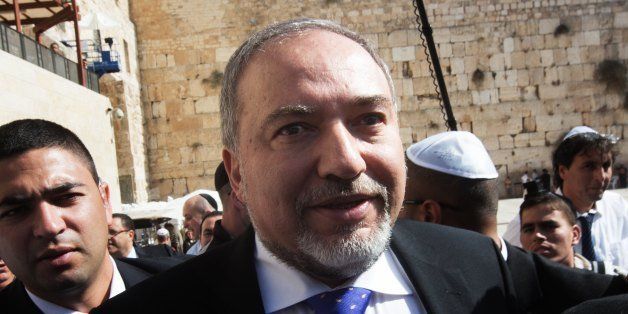 Former Israeli Foreign Minister Avigdor Lieberman visits the Western Wall after the verdict in his trial on November 6, 2013 in Jerusalem. Lieberman was acquitted on corruption charges in a move welcomed by Prime Minister Benjamin Netanyahu, who hailed his anticipated return to government as foreign minister. AFP PHOTO /MENAHEM KAHANA (Photo credit should read MENAHEM KAHANA/AFP/Getty Images)