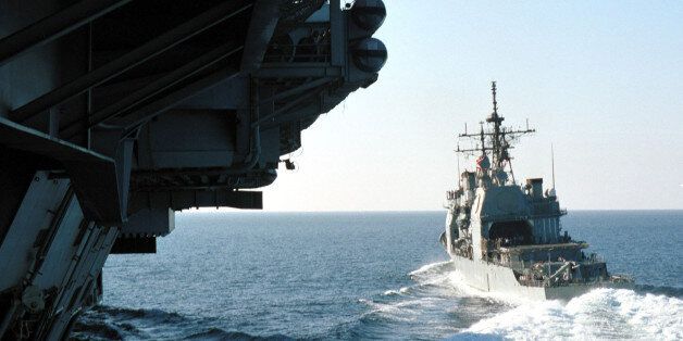 398452 13: The guided missile cruiser USS Antietam breaks away from the aircraft carrier USS Carl Vinson after a refueling at sea December 7, 2001 at the Arabian Sea. The Antietam is part of the Vinson Battle Group which is in support of Operation Enduring Freedom. (Photo by US Navy/Getty Images)