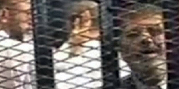 CAIRO, EGYPT NOVEMBER 4 : Mohammed Morsi is seen in court on November 4, 2013 for his trial at Cairo Police Academy in Egyp