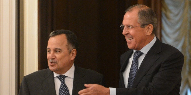 Russian Foreign Minister Sergei Lavrov (R) speaks with his Egyptian counterpart Nabil Fahmy as they meet in Moscow, on Septem
