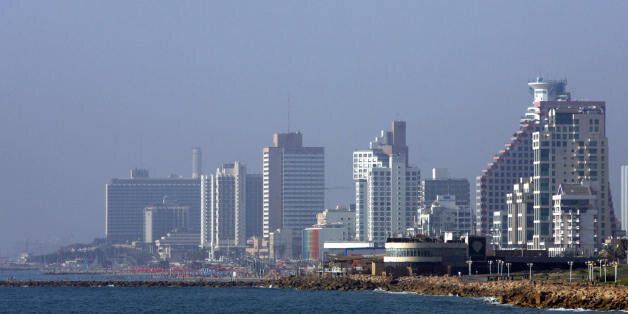 Tel Aviv, ISRAEL: A picture shows a portion of the skyline of the Israeli city of Tel Aviv, as seen from its bay 28 June 2007. Tel Aviv, founded in 1909 under the British Mandate in Palestine, has been dubbed as the 'White City' due to the extensive building activities based on the urban plan of Sir Patrick Geddes that reflected modern organic planning principles. Architects applied in their planning criteria drown from minstream European artistic movement such as the Bauhaus. In 2003, UNESCO inscribed Tel Aviv in the World Heritage List. AFP PHOTO/JACK GUEZ (Photo credit should read JACK GUEZ/AFP/Getty Images)
