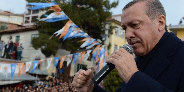 MANISA, TURKEY - DECEMBER 29 : Turkish Prime Minister Recep Tayyip Erdogan addresses to the public on December 29, 2013 in Manisa, Turkey. (Photo by Kayhan Ozer/Anadolu Agency/Getty Images)