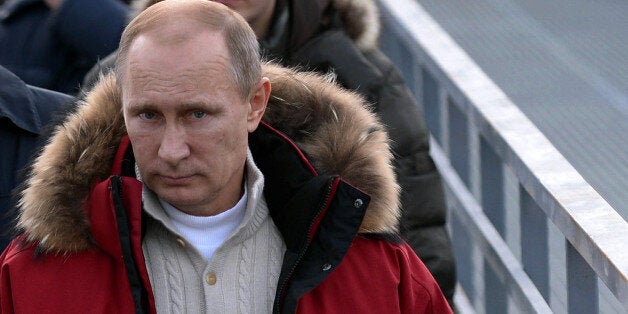 Russia's President Vladimir Putin visits the 'RusSki Gorki' Jumping Center at the Krasnaya Polyana resort near the Black Sea city of Sochi, on January 3, 2014. Sochi will host the 2014 Winter Olympics that start on February 7, 2014. The jacket reads: V.V.Putin. AFP PHOTO/ RIA-NOVOSTI/ POOL/ ALEXEI NIKOLSKY (Photo credit should read ALEXEI NIKOLSKY/AFP/Getty Images)