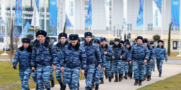 SOCHI, RUSSIA - JANUARY 07: Number of police officers walk in front of the main press center in the olympic park opened for the 2014 Winter Olympic Games in Sochi on January 7, 2014 in Sochi, Russia. (Photo by The Asahi Shimbun via Getty Images)