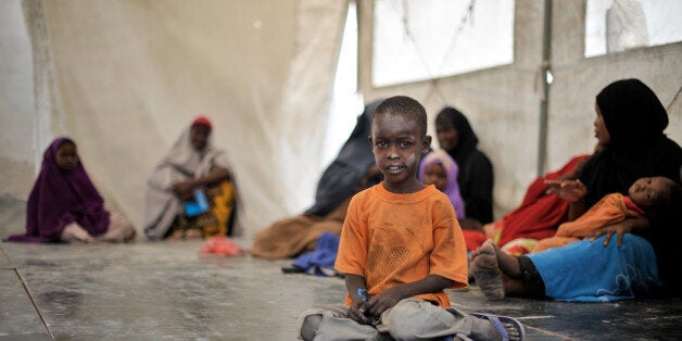 This picture released by the African Union shows a young boy waiting to be seen by a doctor during an outpatient day for civilians in Mogadishu on December 11. AFP PHOTO / AU UN IST PHOTO / Tobin JonesRESTRICTED TO EDITORIAL USE - MANDATORY CREDIT 'AFP PHOTO / AU UN IST / Tobin Jones' - NO MARKETING - NO ADVERTISING CAMPAIGNS - DISTRIBUTED AS A SERVICE TO CLIENTS (Photo credit should read TOBIN JONES/AFP/Getty Images)