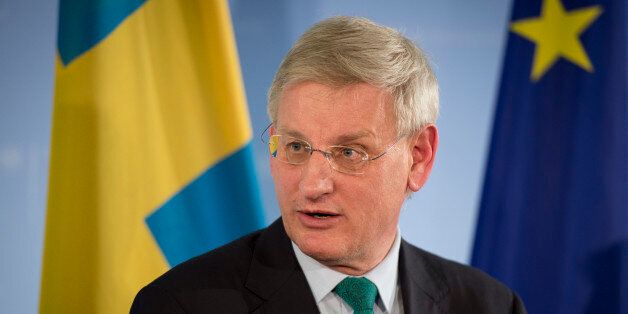 Sweden's foreign minister Carl Bildt and German foreign minister (not in picture) speak during a joint press conference after a meeting at the foreign ministry in Berlin on January 8, 2014 . AFP PHOTO / ODD ANDERSEN (Photo credit should read ODD ANDERSEN/AFP/Getty Images)