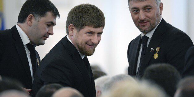 Chechnya's leader Ramzan Kadyrov (C) smiles in the St. George Hall of the Grand Kremlin Palace in Moscow, on December 12, 2013, before President Vladimir Putin's annual state of the nation address. AFP PHOTO / ALEXANDER NEMENOV (Photo credit should read ALEXANDER NEMENOV/AFP/Getty Images)