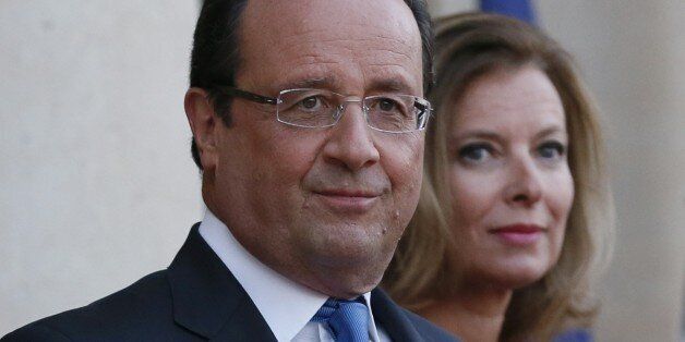 French President Francois Hollande (L) and his companion Valerie Trierweiler wait for the German President and his companion at the Elysee presidential palace on September,3, 2013, in Paris, before a state dinner. AFP PHOTO / PATRICK KOVARIK (Photo credit should read PATRICK KOVARIK/AFP/Getty Images)