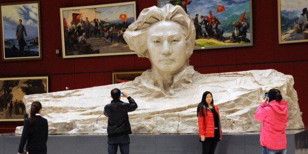 BEIJING, CHINA - DECEMBER 26: (CHINA OUT) People take photos in front of a statue of Mao Zedong at an art exhibition called 'Giant Mao Zedong' at National Museum of China on December 26, 2013 in Beijing, China. A number of celebrations are being held across China to mark the 120th Anniversary of Mao Zedong's Birth. (Photo by ChinaFotoPress via Getty Images)