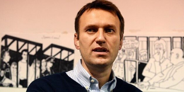 Russian protest leader Alexei Navalny visits an art exhibition 'Draw a court' after the hearing of his case in a court in the northern provincial city of Kirov, on October 16, 2013. A Russian court on October 16, 2013 converted his five-year sentence into a suspended term. AFP PHOTO / VASILY MAXIMOV (Photo credit should read VASILY MAXIMOV/AFP/Getty Images)