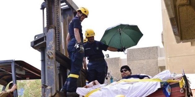Saudi Khaled Mohsen Chaïri, who suffers from extreme obesity weighing 610 kilograms, is transported with a fork-lift truck on
