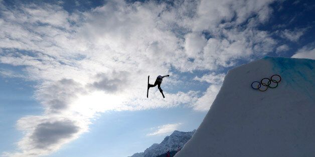 ADDS NAME OF SKIER - Germany's Lisa Zimmermann takes a jump during freestyle skiing slopestyle training at the 2014 Winter Olympics, Monday, Feb. 10, 2014, in Krasnaya Polyana, Russia. (AP Photo/Sergei Grits)