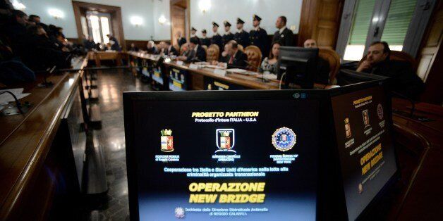 Italian and U.S. authorities talk during a press conference on an anti-Mafia operation with numerous arrests reported on both sides of the Atlantic, in Rome's National Anti-Mafia headquarters, on February 11, 2014. The so called 'New Bridge' joined operation targeted a new cocaine trafficking route from South America to the southern Italian port of Gioia Tauro linking the US sicilian Mafia with the Calabrian n'drangheta crimiminal organization. AFP PHOTO / Filippo MONTEFORTE (Photo credit should read FILIPPO MONTEFORTE/AFP/Getty Images)