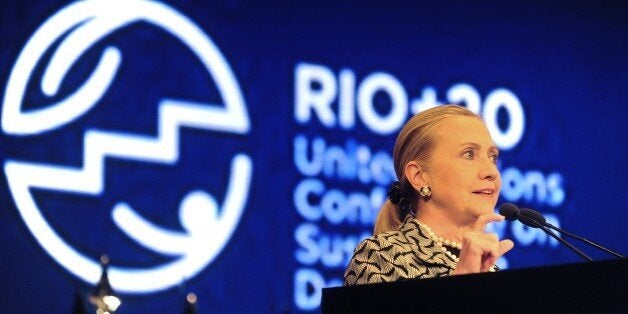 US Secretary of State Hillary Clinton delivers a speech during a plenary session of the UN Conference on Sustainable Development, Rio+20, in Rio de Janeiro, Brazil, on June 22, 2012. World leaders attending the UN summit in Rio weighed steps to root out poverty and protect the environment as thousands of activists held several protests to denounce Amazon rainforest deforestation, the plight of indigenous peoples and the 'green economy' being advocated at the UN gathering. AFP PHOTO / ANTONIO SCORZA (Photo credit should read ANTONIO SCORZA/AFP/GettyImages)