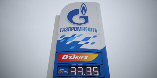 Fuel price signs stand on display at a gas station operated by OAO Gazprom Neft in Moscow, Russia, on Wednesday, Feb. 12, 2014. Gazprom Neft, the oil arm of Russia's natural-gas exporter, has decided on a phased move to the city of Saint Petersburg where it is building a skyscraper headquarters expected to be completed in 2018. Photographer: Andrey Rudakov/Bloomberg via Getty Images