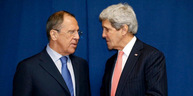 Russia's Foreign Minister Sergei Lavrov (L) and US Secretary of State John Kerry meet to discuss the Ukraine crisis on the sidelines of an International conference on Libya in Rome on March 6, 2014. Stepping up the pressure on Russia, the United States imposed today visa restrictions and set the stage for other potential sanctions over the Russian intervention in Crimea. AFP PHOTO / POOL / Kevin Lamarque (Photo credit should read KEVIN LAMARQUE/AFP/Getty Images)