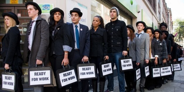 British musicians Miss Dynamite (5th L) and Charlie Simpson (6th L) join unemployed young people as they stand in line outsid