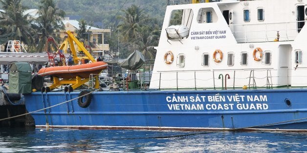 A Vietnam coast guard ship is seen anchored at a local naval base at Phu Quoc island, in the waters of southern Vietnam, where a Malaysian Airlines jet was presumed lost on March 8, 2014. Vietnam said its search planes spotted oil slicks in the sea near where a Malaysia Airlines jet with 239 people mysteriously vanished and was presumed lost. AFP PHOTO/LE QUANG NHAT (Photo credit should read LE QUANG NHAT/AFP/Getty Images)