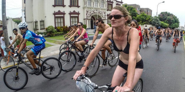 Peruvian cyclists ride naked and half-naked to defend their spaces in the city during the 9th edition of the Naked Bike event, in Lima, Peru on March 8, 2014. AFP PHOTO/SEBASTIAN CASTANEDA (Photo credit should read SEBASTIAN CASTAÑEDA/AFP/Getty Images)