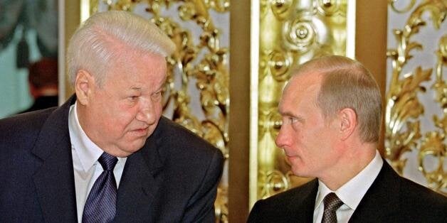 MOSCOW, RUSSIA: Russian President Vladimir Putin (R) chats with the first President of Russia, Boris Yeltsin (L), during the