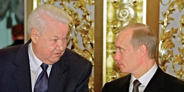 MOSCOW, RUSSIA: Russian President Vladimir Putin (R) chats with the first President of Russia, Boris Yeltsin (L), during the State reception in Kremlin, devoted to the Day of Declaration of Sovereignty in Moscow, 12 June 2001. Vladimir Putin has signed a decree on awarding Boris Yeltsin with the order 'For Services to the Fatherland' of first degree. (Photo credit should read AFP/Getty Images)