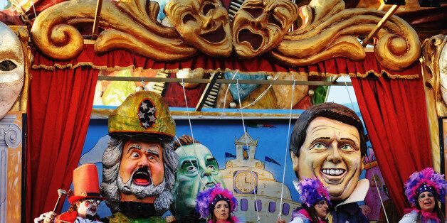 VIAREGGIO, ITALY - MARCH 09: A giant papier-mache float representing Italian Prime Minister Matteo Renzi (R) and comedian and politician beppe Grillo (L) moves through the streets of Viareggio during the traditional Carnival parade on March 9, 2014 in Viareggio, Italy. The Carnival of Viareggio is considered one of the most important carnivals in Italy and is characterised by its giant papier-mache floats representing caricatures of popular characters, politicians and fictional creations. (Photo by Laura Lezza/Getty Images)