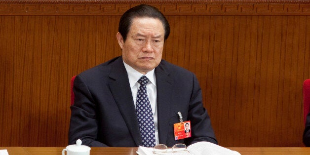 Zhou Yongkang, China's top security official, attends a plenary session on the draft amendment to the Criminal Procedure Law