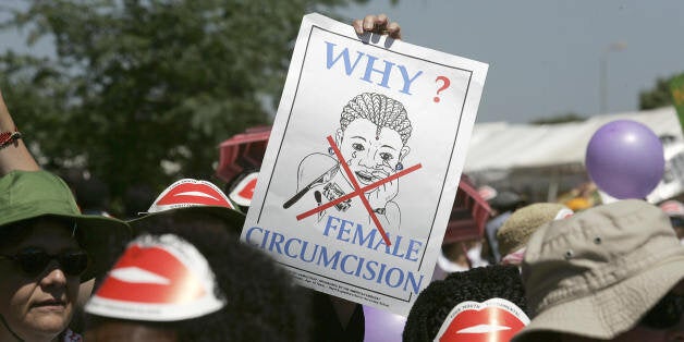 Nairobi, KENYA: Members of African Gay and Lesbian communities demonstrate against female genital mutilation, 23 January 2007 at the Nairobi World Social Forum venue in Kasarani, Nairobi. Some 46,000 participants are attending the seventh edition of the World Social Forum taking place this week in Kenya, organisers said Monday as hundreds of youths protested registration charges. Organisers had hoped to attract about 160,000 anti-globalisation activists, but about one third of that figure turned up for the conference that kicked off in Nairobi at the weekend and set to conclude on Thursday. AFP PHOTO/MARCO LONGARI (Photo credit should read MARCO LONGARI/AFP/Getty Images)