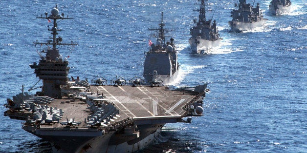 US aircraft carrier USS George Washington leads a US guided missile cruiser and three Japanese destroyers during the Keen Swo