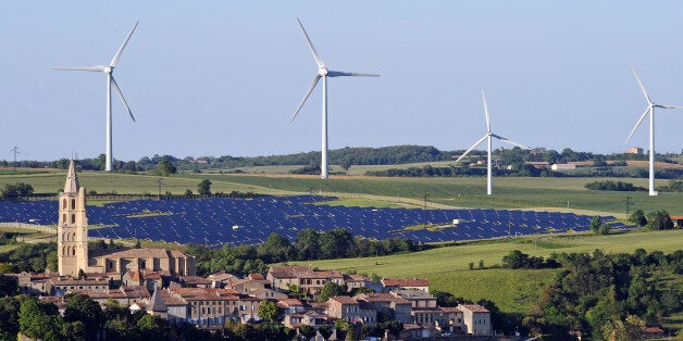 Wind turbines and a solar park are pictured on May 26, 2013 near the village of Avignonet-Lauragais, located southeast of Tou