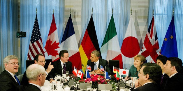 THE HAGUE, NETHERLANDS - MARCH 24: (L-R) President of the European Council Herman van Rompuy, Canadian Prime Minister Stephen Harper, French President Francois Hollande, British Prime Minster David Cameron, U.S. President Barack Obama, German Chancellor Angela Merkel, Japanese Prime Minister Shinzo Abe, Italian Prime Minister Matteo Renzi and President of the European Commission Jose Manuel Barroso attend a meeting of the G7 leaders on March 24, 2014 in The Hague, Netherlands. The G7 countries are meeting to discuss the recent developments in Ukraine, and to consider their response and any sanctions to be imposed upon Russia in answer to its annexing of the Crimea region. (Photo by Jerry Lampen - Pool/Getty Images)