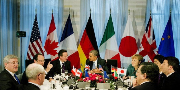 THE HAGUE, NETHERLANDS - MARCH 24: (L-R) President of the European Council Herman van Rompuy, Canadian Prime Minister Stephen Harper, French President Francois Hollande, British Prime Minster David Cameron, U.S. President Barack Obama, German Chancellor Angela Merkel, Japanese Prime Minister Shinzo Abe, Italian Prime Minister Matteo Renzi and President of the European Commission Jose Manuel Barroso attend a meeting of the G7 leaders on March 24, 2014 in The Hague, Netherlands. The G7 countries are meeting to discuss the recent developments in Ukraine, and to consider their response and any sanctions to be imposed upon Russia in answer to its annexing of the Crimea region. (Photo by Jerry Lampen - Pool/Getty Images)