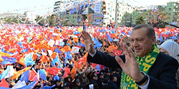 SANLIURFA, TURKEY - MARCH 9: Turkish Prime Minister Recep Tayyip Erdogan greets the crowd during a local election rally organ