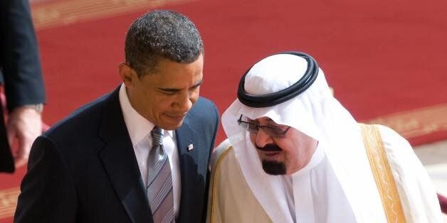 US President Barack Obama speaks with Saudi King Abdullah bin Abdul Aziz al-Saud (R) during an arrival ceremony at the King Khaled international airport in Riyadh on June 3, 2009. Obama arrived in Saudi Arabia at the start of a mission to the Middle East where he will reach out to the world's Muslims and promote peace. Saudi Arabia laid on a red carpet welcome for Obama, who is due to hold talks with King Abdullah before heading to Egypt on June 4 to give a much-anticipated address to the Muslim world at Cairo University. AFP PHOTO/Saul LOEB (Photo credit should read SAUL LOEB/AFP/Getty Images)