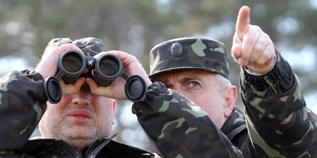 Acting Minister of Defence of Ukraine Michail Koval (R) and Olexander Turchynov, speaker of the parliament and the interim pr