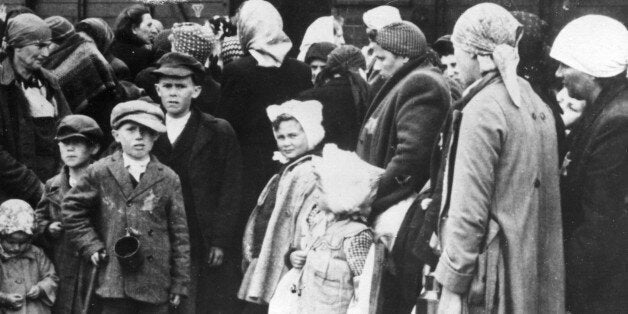 Auschwitz, poland, world war 2, concentration camp victims after disembarking from a freight train at the station near the camp. (Photo by: Sovfoto/UIG via Getty Images)