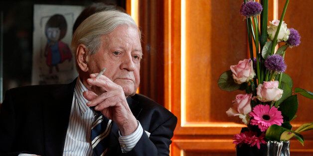 Former German Chancellor Helmut Schmidt smokes a cigarette during a meeting with Prime Minister of China, Li Keqiang (not in picture) in Berlin, on May 27, 2013. AFP PHOTO / POOL / MICHAEL SOHN (Photo credit should read MICHAEL SOHN/AFP/Getty Images)
