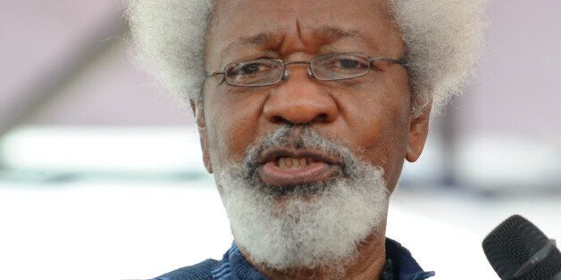 Social critic Professor Wole Soyinka speaks on the Nigerian secessionist leader Odumegwu Ojukwu during the national inter-denominational funeral rites at Michael Opkara Square in Enugu, southeastern Nigeria, on March 1, 2012. Soldiers fired a 21-gun salute at the funeral of Odumegwu Ojukwu on Thursday as Nigerian leaders paid final respects to the man whose 1967 declaration of Biafran independence sparked a civil war. Forty-five years after he tried to split Nigeria asunder by proclaiming the Republic of Biafra, Ojukwu's coffin was draped in the national colours of white and green at the funeral service in the city of Enugu, attended by thousands. Ojukwu died in November in Britain at the age of 78 but his body was only flown back on Monday. AFP PHOTO/ PIUS UTOMI EKPEI (Photo credit should read PIUS UTOMI EKPEI/AFP/Getty Images)