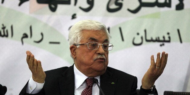 Palestinian Authority President Mahmud Abbas gestures as he gives a speech during a meeting with the Palestine Liberation Org